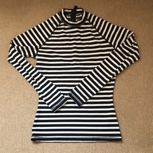Summer chic. Striped rash guard perfect for beach